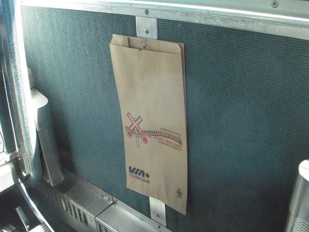 Camp table hanging trash-bag rail